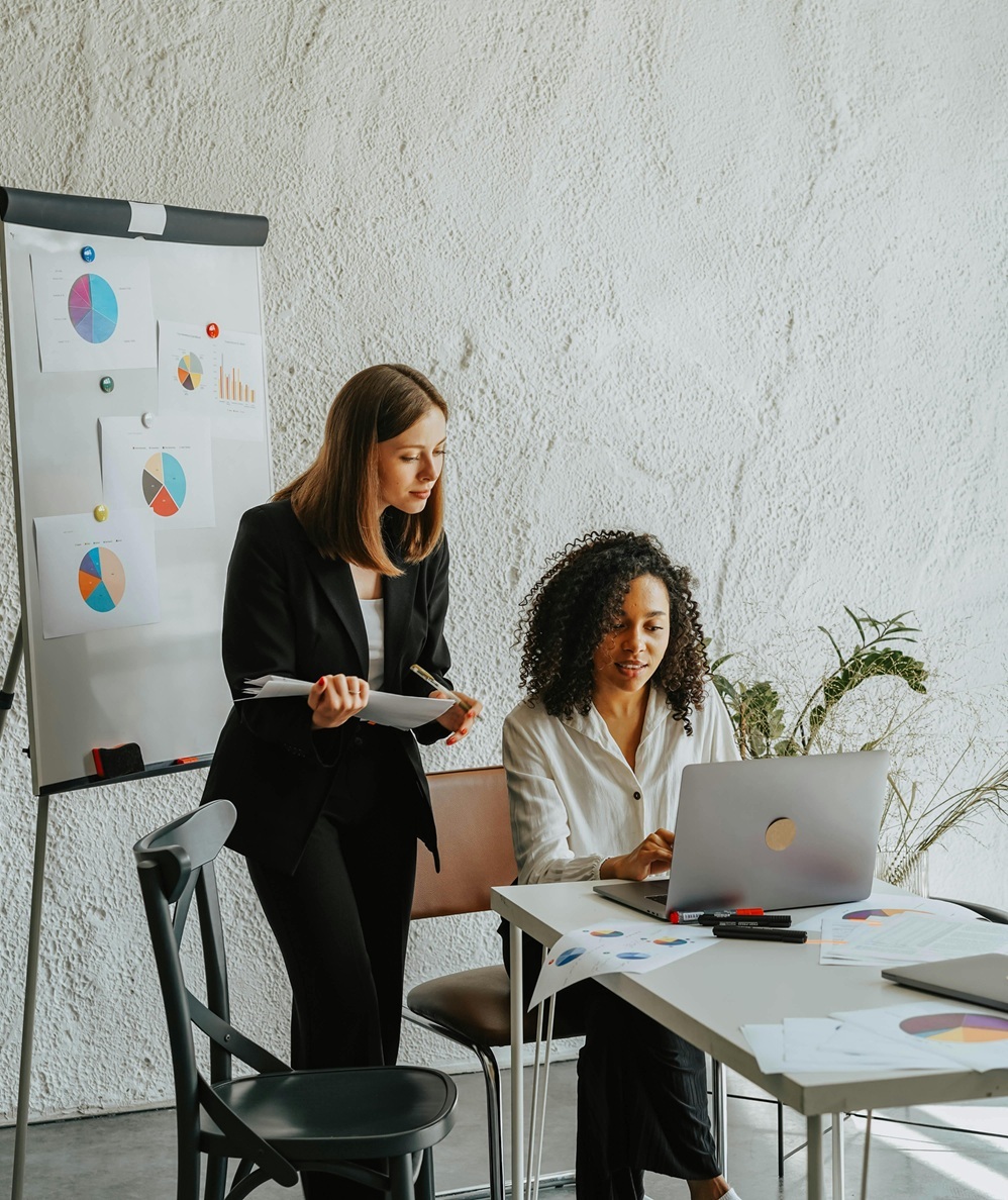 Two women collaborating in a meeting room